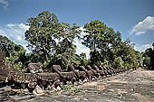 Preah Khan temple - east entrance of the fourth enclosure, the bridge lined by devas and asuras.